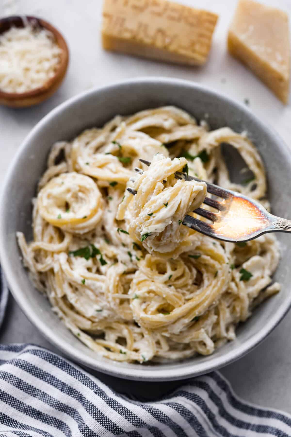 Creamy Parmesan Pasta Roni uses just 6 ingredients and one pan! It's loaded with creamy parmesan sauce and perfectly cooked al denta noodles. Your whole family will go crazy over this delicious, quick, easy meal. Overhead shot of plated creamy parmesan pasta roni.