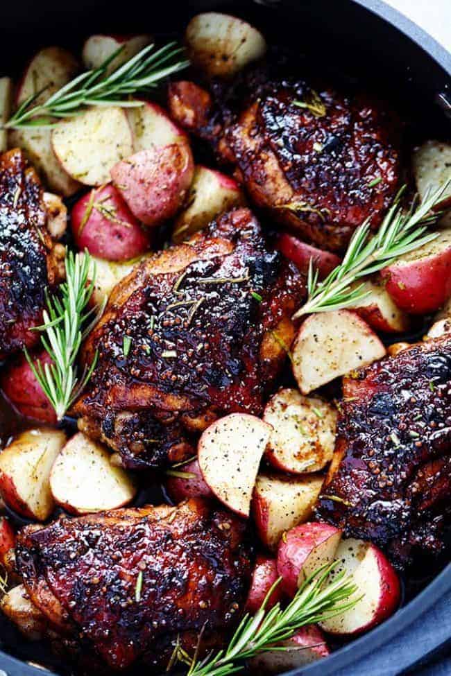 Glazed Honey Balsamic Chicken with Potatoes is a one pan meal with tender and juicy chicken glazed in a sweet and tangy honey balsamic sauce. Surrounded by crisp and tender potatoes this is one delicious meal! Glazed honey balsamic chicken with potatoes in a large pot.