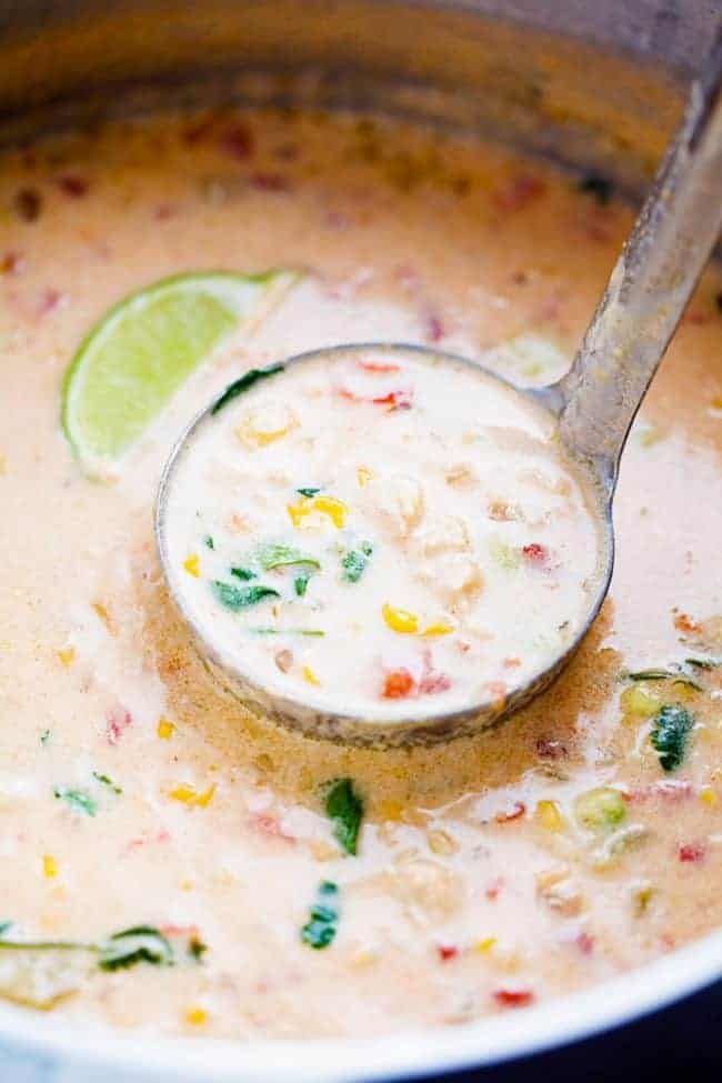 Mexican Chicken Corn Chowder is creamy, cheesy and so easy to make! ย It has just enough of a kick to it and the flavor is incredible. ย This will be one of the best chowders that you will eat! Mexican chicken corn chowder on the stove top.