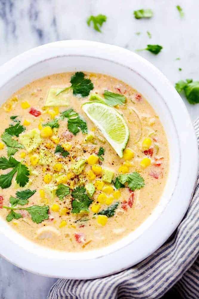 Mexican Chicken Corn Chowder is creamy, cheesy and so easy to make! ย It has just enough of a kick to it and the flavor is incredible. ย This will be one of the best chowders that you will eat! Mexican chicken corn chowder in a bowl.