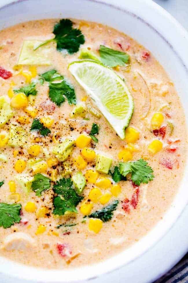 Mexican Chicken Corn Chowder is creamy, cheesy and so easy to make! ย It has just enough of a kick to it and the flavor is incredible. ย This will be one of the best chowders that you will eat! Mexican chicken corn chowder in a bowl.