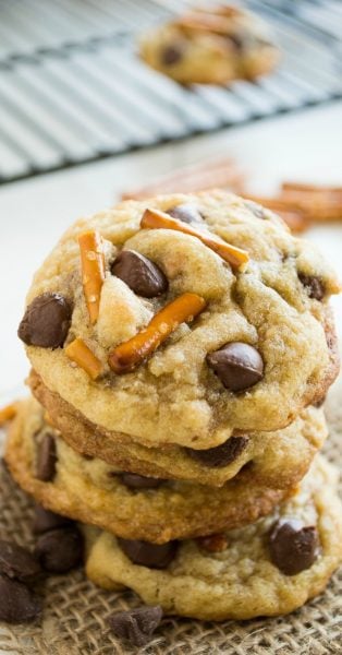 The ULTIMATE Cookie Exchange with more than 50 of the VERY BEST cookies on the internet! I've looked high and low and promise you these are the very yummiest cookies around. Get your whisk ready and preheat your oven because you will want to make every single one! Brown butter toffee pretzel chocolate chip cookie stacked on top of each other.