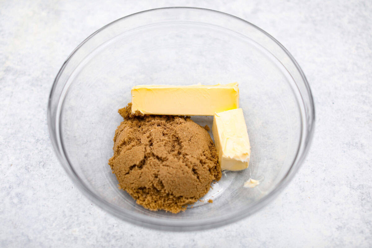 Chocolate Snowball Cookies are tender chocolate cookies with the best texture! A buttery cookie made with cocoa powder and ground walnuts gets coated in sweet powdered sugar. Make this classic holiday cookie a tradition every year! Second photo of the butter and sugar in a bowl.