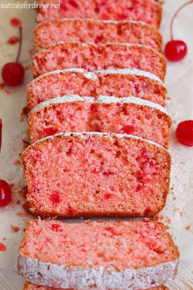 Cherry Almond Bread is so quick and easy to make and perfectly moist! The cherry almond flavor is incredible and you won't be able to get enough!ย Cherry Almond Bread sliced in slices.