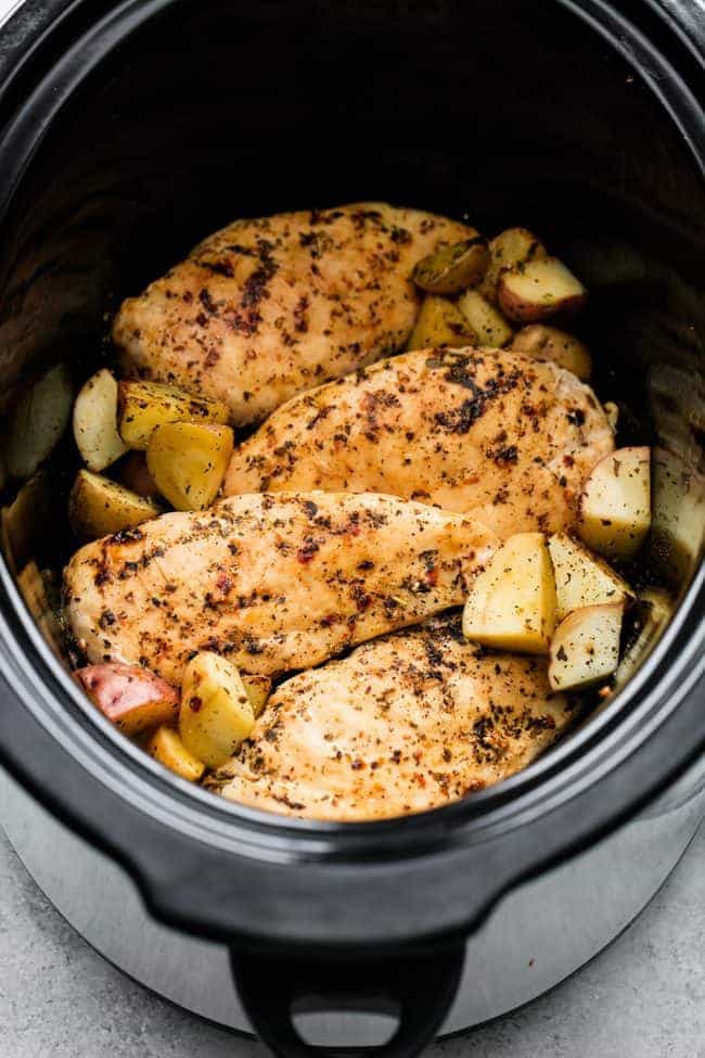 Slow Cooker Italian Chicken and Potatoes is such an easy meal to make but packed with such amazing flavor! The entire family will love this hearty meal in one. Slow cooker Italian chicken and potatoes in a crockpot.
