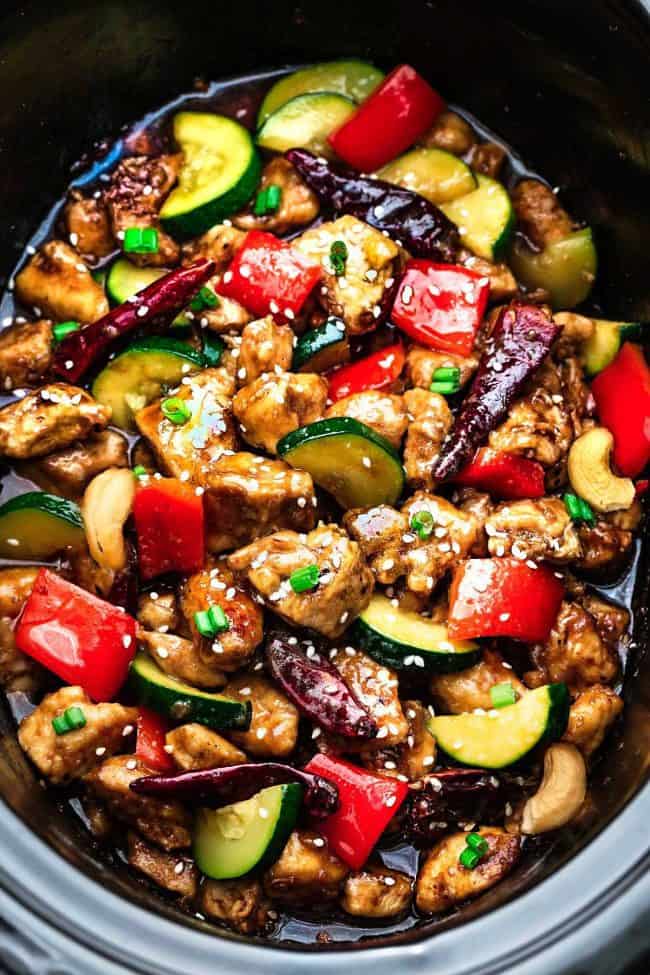Skinny Slow Cooker Kung Pao Chickenย is aย delicious chicken coated in a sweet and spicy sauce with tender vegetables and crunchyย cashews. Skip the takeout, this is so muchย healthier and better! Skinny Slow Cooker Kung Pao Chicken in a slow cooker.