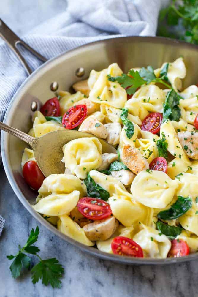 This Oneย Pot Creamy Parmesan Chicken Tortellini is aย family friendly meal that's ready in no time! It's packed full of golden brown chicken, veggies and tortellini, all in a creamy parmesan sauce. This one pot chicken with tortellini is a family friendly meal that's ready in no time! It's packed full of golden brown chicken, veggies and tortellini, all in a creamy parmesan sauce.