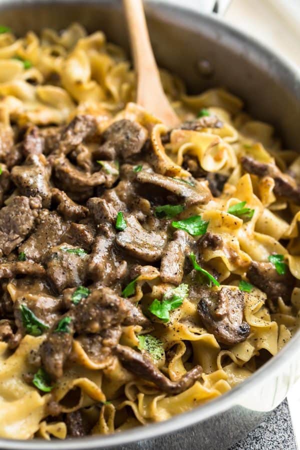 One Pot Beef Stroganoff has all the delicious flavors you love about this classic comfort food made easier in just ONE pan! Strips of tender beef, soft egg noodles coated in a creamy mushroom sauce and perfect for busy weeknights! one pot beef stroganoff