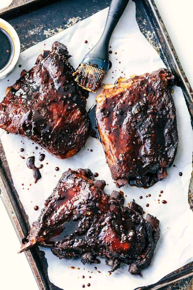 Slow Cooker Sticky Asian Ribs with Sticky Sauce are the very best fall of the bone tender ribs you will ever make! Slow cooked to perfection in a sweet and tangy asian sauce. They get slathered right before serving in a finger licking good sticky sauce! Slow Cooker Sticky Asian Ribs with Sticky Sauce.