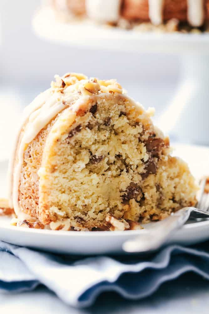 Glazed walnut butter cake is unbelievably good! Slice of glazed Walnut Butter Cake on a white plate.
