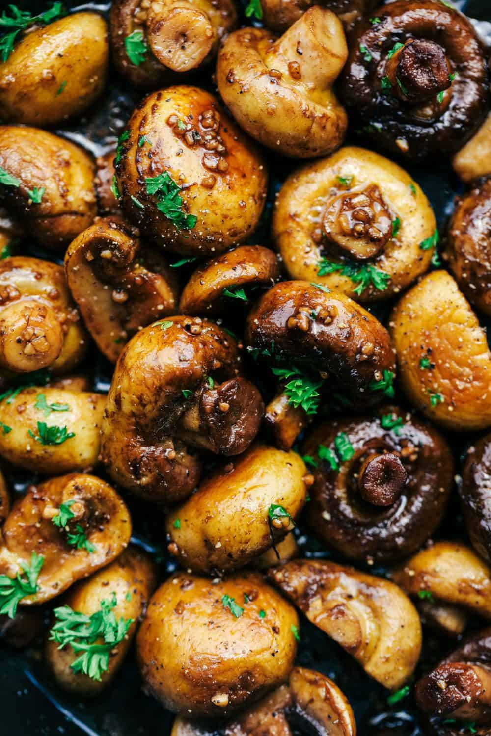 Honey Balsamic Garlic Mushrooms are sautรฉed in the most incredible honey balsamic garlic sauce. This makes an excellent topping for steak or chicken or is even great as a side dish!ย Honey Balsamic Garlic Mushrooms close up.