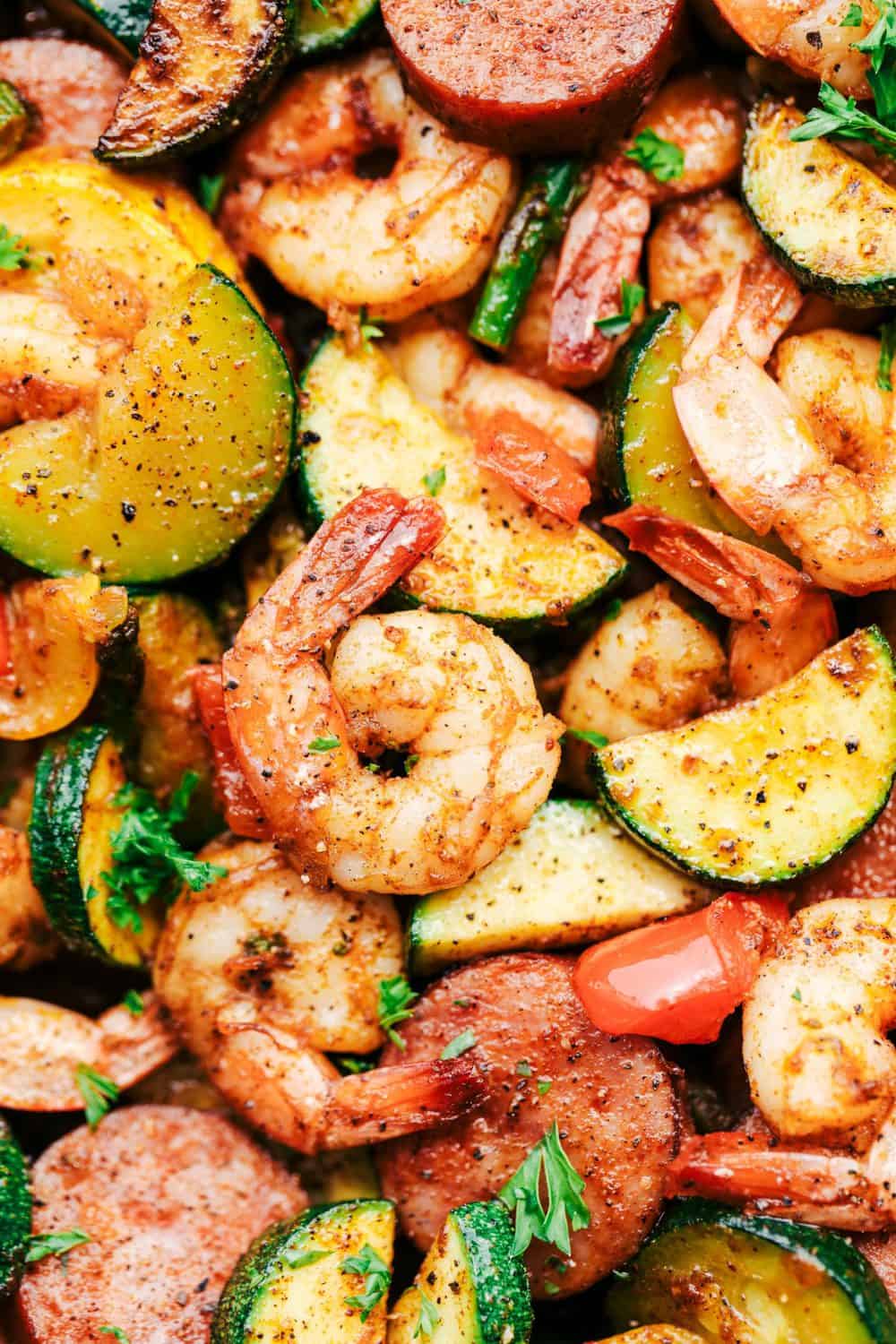 Cajun Shrimp and Sausage Vegetable Skillet is the BEST 20 minute meal packed with awesome cajun flavor with shrimp, sausage, and summer veggies. This makes a great low carb meal and is also great for meal prep! Cajun Shrimp and Sausage Vegetable Skillet close up