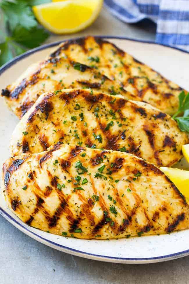 This grilled citrus and herb chicken is juicy, tender, and flavored with the best marinade. A super easy dish that's ready in no time! Grilled citrus and herb chicken on a plate.