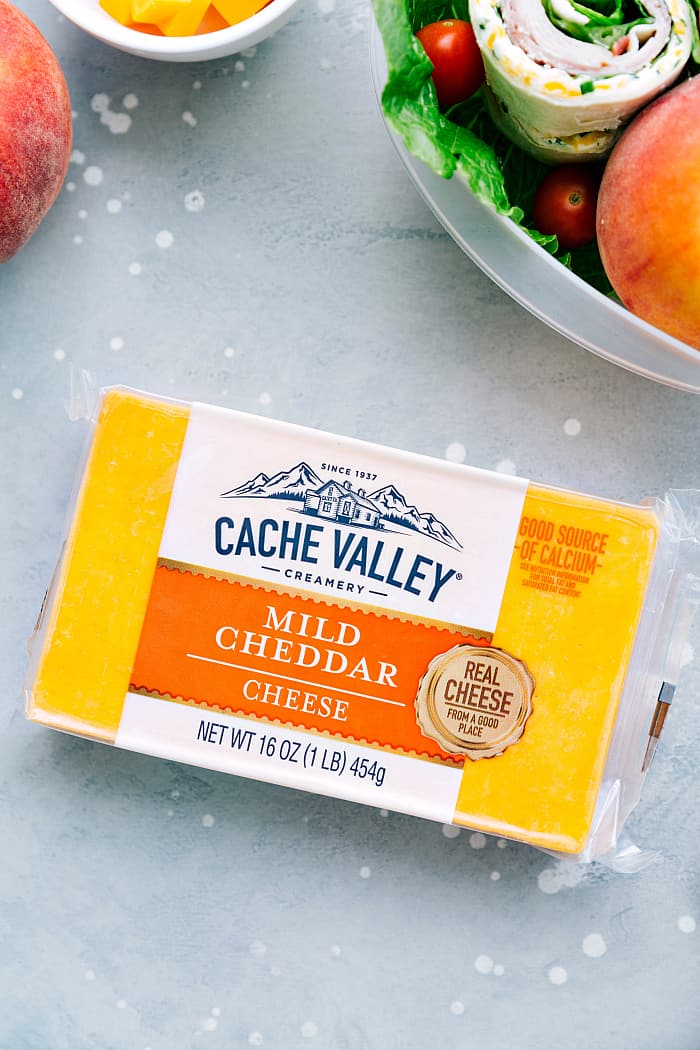 Turkey Bacon Ranch Pinwheels are an easy wrap with turkey, bacon, ranch and cheese and are perfect for an appetizer or lunch! They are delicious served hot or cold and are sure to please your tastebuds. Mild cheddar cheese in a package.