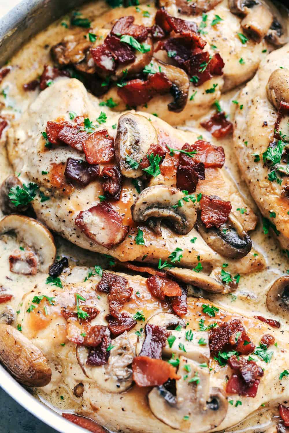 Creamy Balsamic Mushroom Bacon Chicken has the most amazing creamy balsamic mushroom sauce with tender and juicy chicken topped with crispy bacon. This is an easy restaurant quality meal you can make at home! Creamy Balsamic Mushroom Bacon Chicken in the skillet.