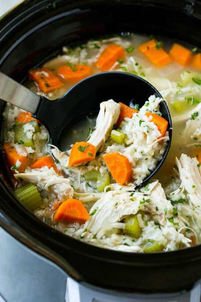 This slow cooker chicken and rice soup is an easy and comforting meal that's perfect for cold nights! This slow cooker chicken and rice soup in a crock pot.