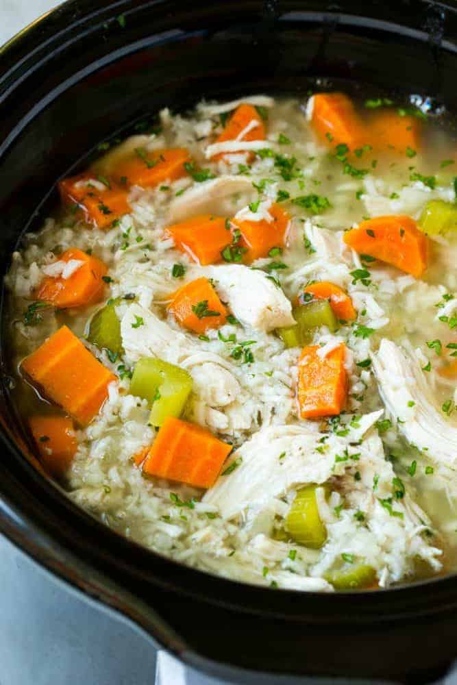 This slow cooker chicken and rice soup is an easy and comforting meal that's perfect for cold nights! chicken and rice soup in a slow cooker.