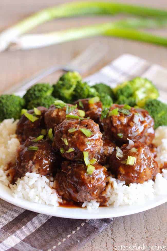 Easy Teriyaki Meatballs come together fast and make such an amazing meal with the delicious teriyaki sauce. They have a sweet and savory flavor from the teriyaki sauce coating a moist and tender meatball. Easy Teriyaki Meatballs with white rice and broccoli on a white plate.