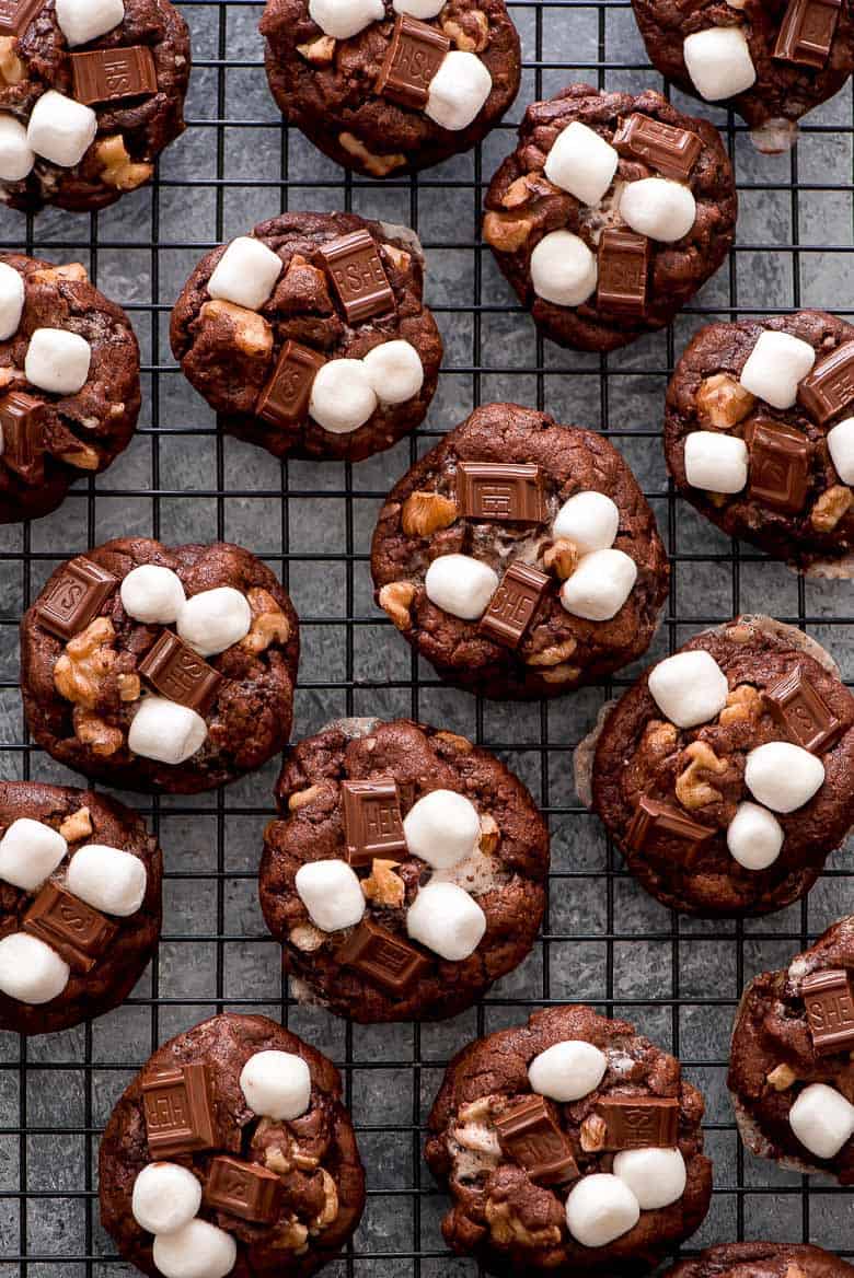 These rich Rocky Road Chocolate Cookies loaded with chocolate chunks, marshmallows, and walnuts are a chocolate lover’s dream come true! These rich Rocky Road Chocolate Cookies on a baking sheet.
