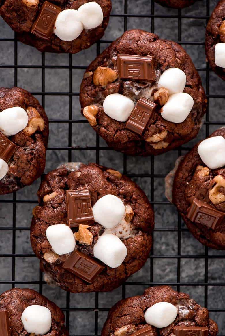 These rich Rocky Road Chocolate Cookies loaded with chocolate chunks, marshmallows, and walnuts are a chocolate lover’s dream come true! These rich Rocky Road Chocolate Cookies on a cooling rack.