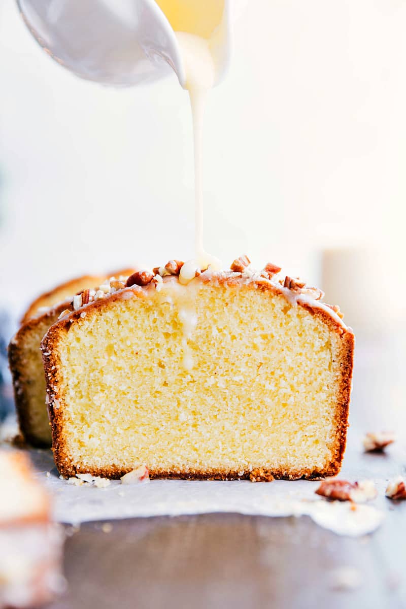 Glazed Eggnog Pound Cake is an easy to make tender and soft pound cake. It gets drizzled with a luscious glaze and is perfect for the holidays! Glazed Eggnog Pound Cake getting drizzled with a luscious glaze.