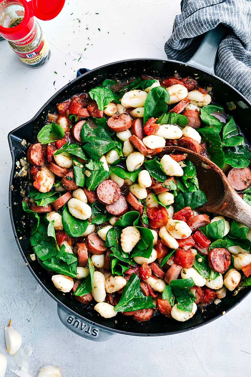 Spinach and Sausageย Gnocchi with Sage is a quick and easy dinner that is filled with sausage, gnocchi, diced tomatoes, spinach, spices, and sage. This is a flavorful and comforting meal!ย Spinach and Sausageย Gnocchi with Sage in a skillet.