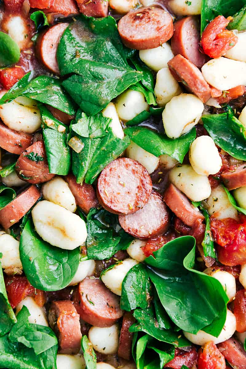 Spinach and Sausageย Gnocchi with Sage is a quick and easy dinner that is filled with sausage, gnocchi, diced tomatoes, spinach, spices, and sage. This is a flavorful and comforting meal!ย Close up on Spinach and Sausageย Gnocchi with Sage.