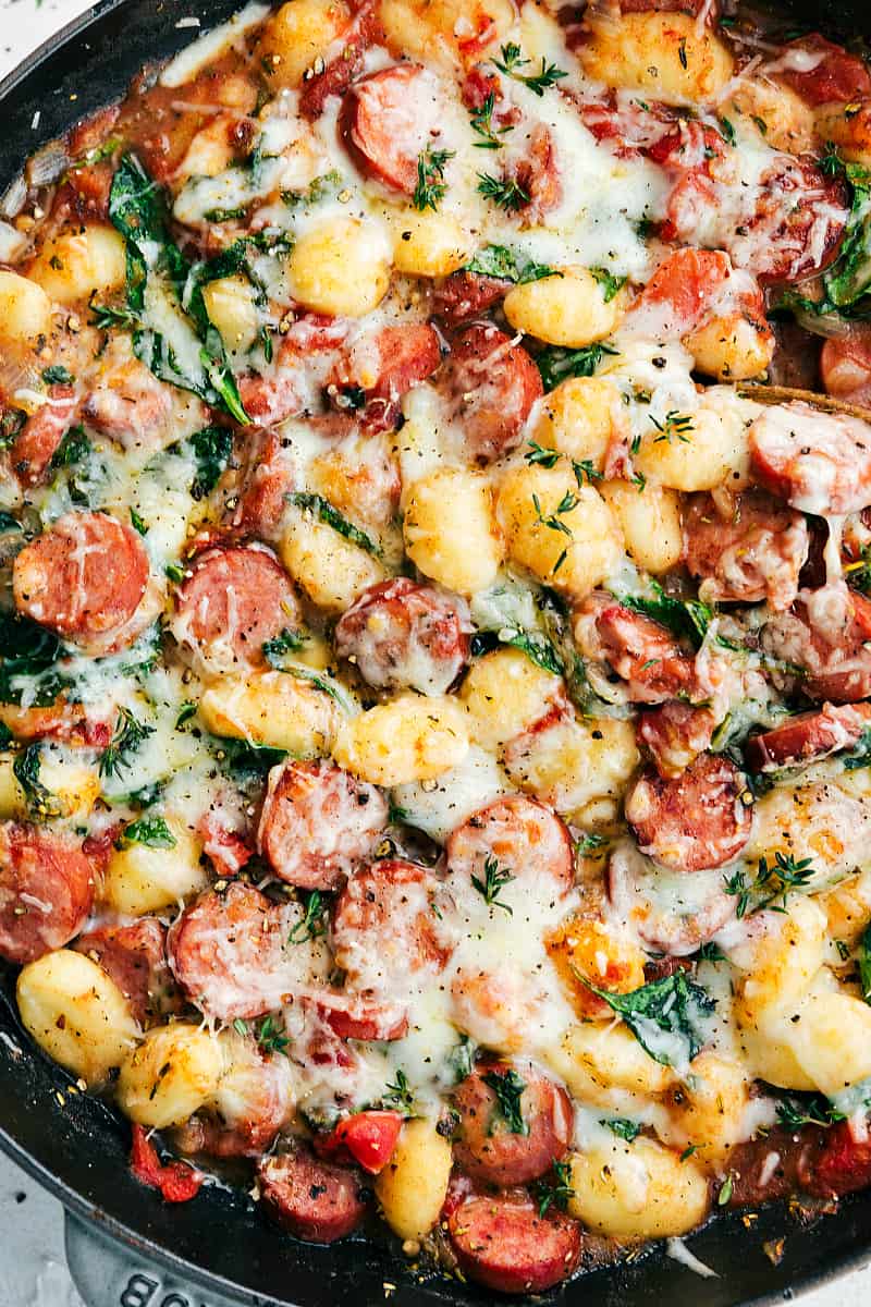 Spinach and Sausageย Gnocchi with Sage is a quick and easy dinner that is filled with sausage, gnocchi, diced tomatoes, spinach, spices, and sage. This is a flavorful and comforting meal!ย Spinach and Sausageย Gnocchi with Sage in a skillet.
