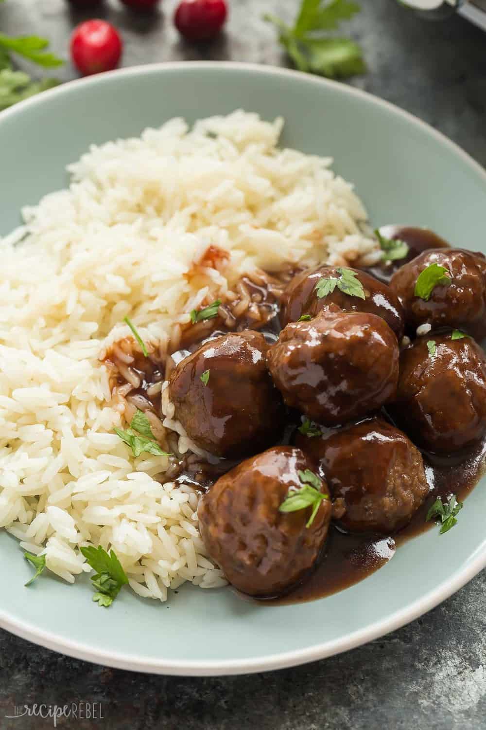 These Slow Cooker Cranberry Balsamic Meatballs are perfect for a holiday dinner or party! Sweet, tangy and so easy! Slow Cooker Cranberry Balsamic Meatballs with white rice.