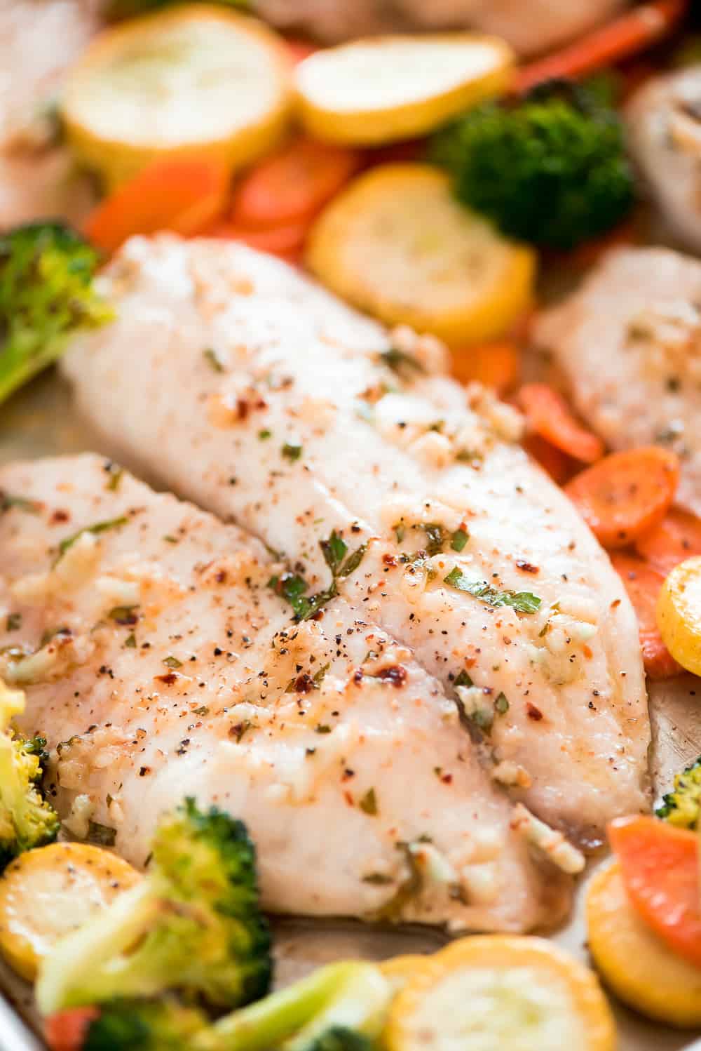 Baked Tilapia and Roasted Veggies is a low calorie and high protein dish that comes together in less than 25 minutes! Light and tasty in every bite!ย This Baked Tilapia and Roasted Veggies is a low calorie and high protein dish that comes together in less than 25 minutes!ย