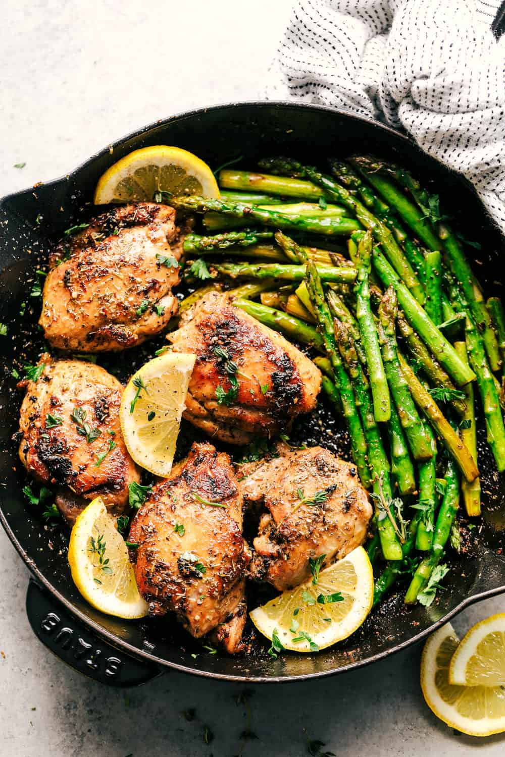 Lemon Garlic Butter Herb Chicken with Asparagus is the easiest 30 minute meal that is bursting with amazing flavor. Cooked in a buttery lemon garlic herb blend to tender juicy perfection with asparagus! Lemon garlic butter herb chicken with asparagus