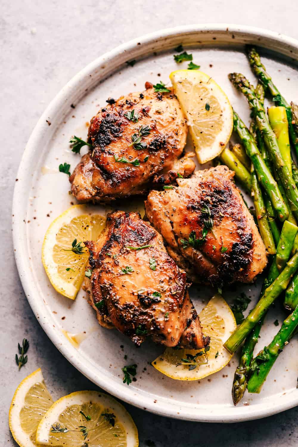 Lemon Garlic Butter Herb Chicken with Asparagus is the easiest 30 minute meal that is bursting with amazing flavor. Cooked in a buttery lemon garlic herb blend to tender juicy perfection with asparagus! lemon garlic butter herb chicken with asparagus