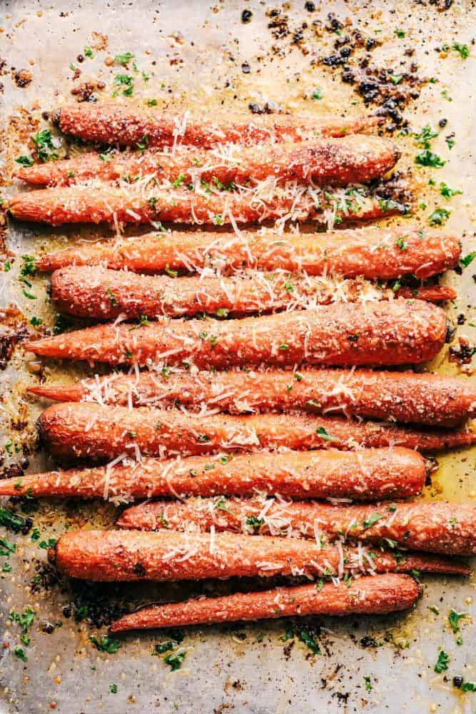 Garlic Butter Parmesan Carrots are roasted to absolute tender perfection in the most amazing garlic butter parmesan coating! These are the best carrots I have ever had!ย Garlic Butter Parmesan Carrots.