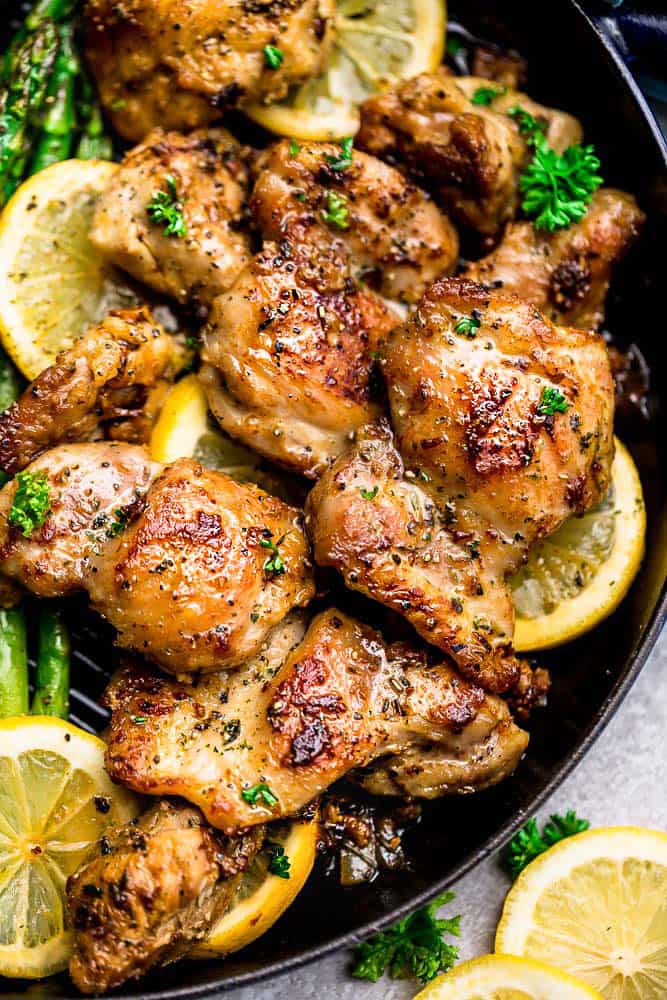 Instant Pot Lemon Garlic Chicken is simple and easy to make in the pressure cooker and perfect for busy weeknights. The chicken cooks up tender and juicy in a buttery lemon garlic sauce. Instant Pot Lemon Garlic Chicken on a plate up close of chicken.
