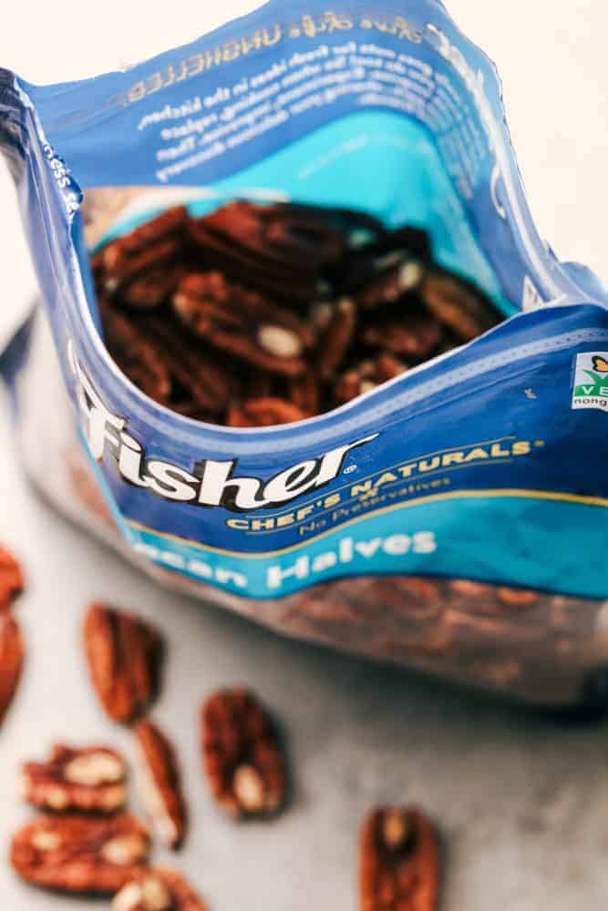 No Bake Banana Caramel Pecan Pie is made with a shortbread crust topped with caramel and a creamy banana filling with crunchy pecans. This makes one incredible no bake pie! An open bag of pecan halves.