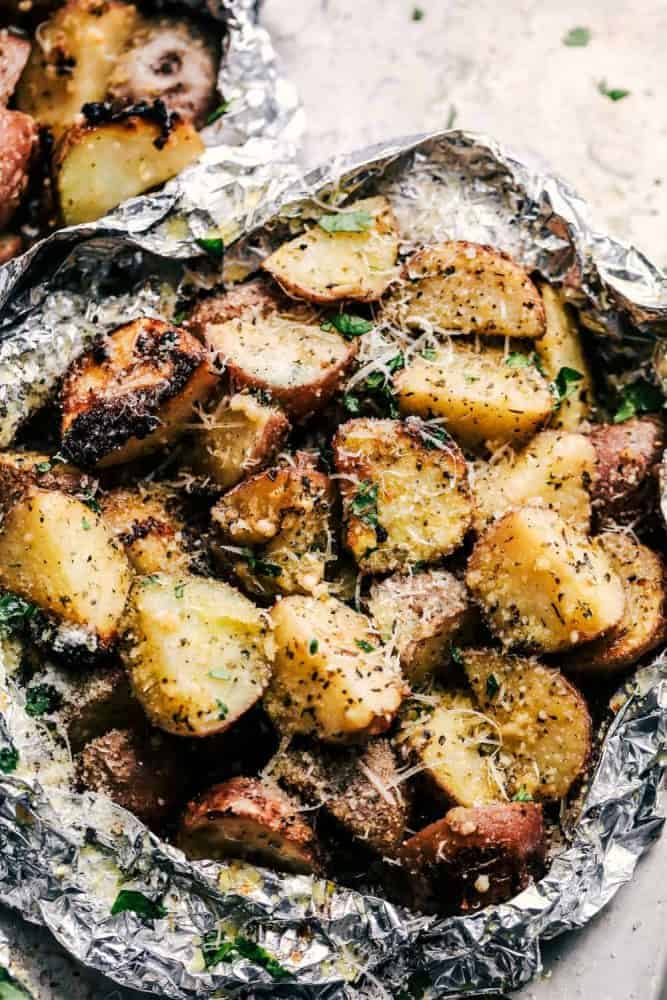Parmesan Garlic Potato Foil Packets are potatoes that get cooked to tender perfection and have the best parmesan garlic flavor! ย These make an amazing side dish to any meal!ย Parmesan Garlic Potato Foil Packets.