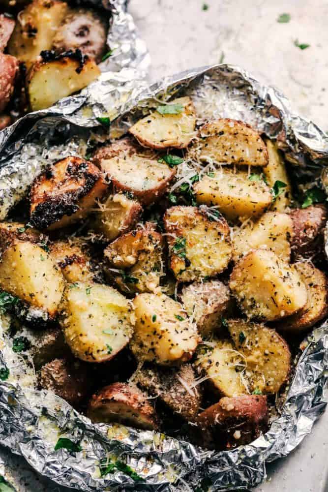 Parmesan Garlic Potato Foil Packets are potatoes that get cooked to tender perfection and have the best parmesan garlic flavor! These make an amazing side dish to any meal!ย One Parmesan Garlic Potato Foil Packet.