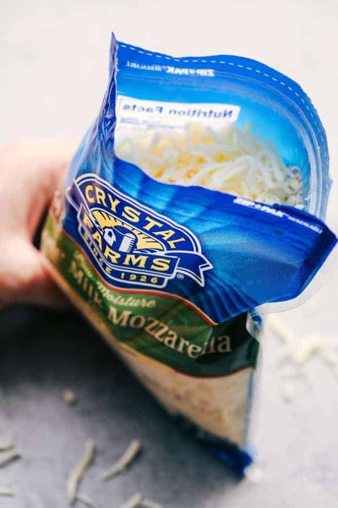 Cheesy Chicken, Bacon and Broccoli Ranch Pasta is a meal in one that is made in one pan and has such amazing creamy ranch flavor! This meal will be a hit with the entire family! Opened bag of Crystal Farms Whole Milk Mozzarella Cheese.