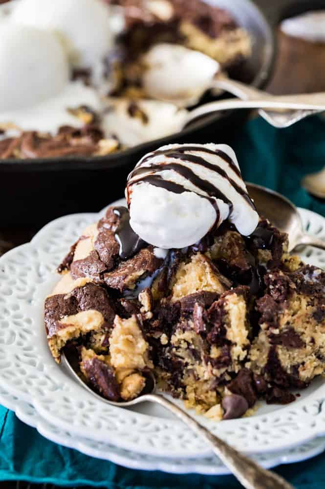 This decadent deep dish skillet brownie cookie is always a crowd pleaser! A plate of brownie cookie.