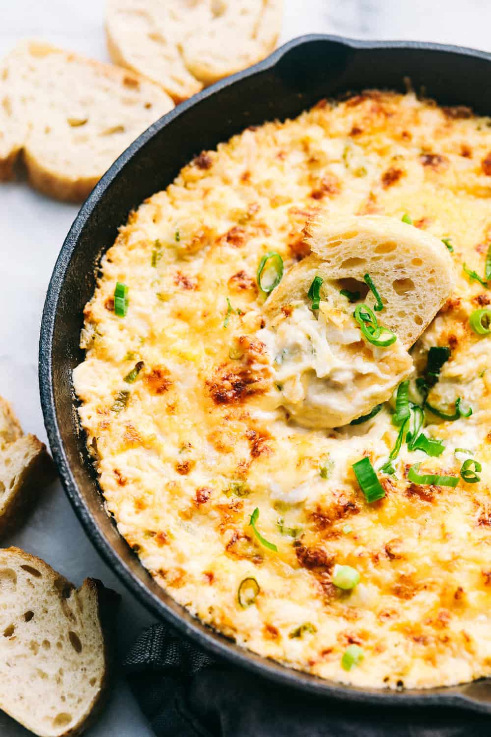 Small Crockpot Method: Keep your dip warm for parties or get-togethers. Use a 2-quart slow cooker on LOW for 1โ2 hours, until hot and melted. Your dip will stay warm and melty for up to 2 hours. Hot Crab Dip in a metal pan with sliced bread on the side.