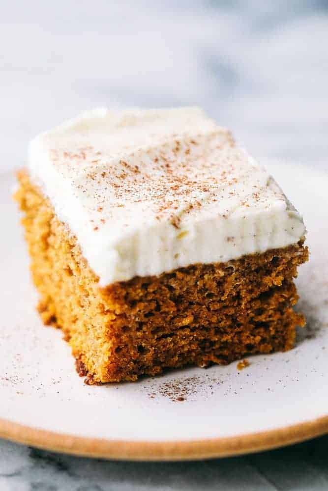 This Pumpkin Cake is the most amazing pumpkin cake you will ever make! ย Perfectly spiced and moist and topped with the most epic cream cheese whipping cream frosting! pumpkin cake