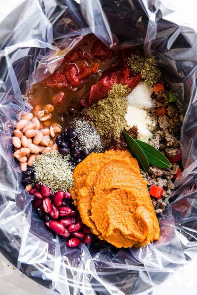 Slow Cooker Pumpkin Chili is the perfect comforting fall soup. It is hearty and packed with spices and big bold flavors. You are going to love this savory and delicious chili!ย All of the ingredients for slow cooker pumpkin chili with a Reynolds Slow cooker liner.