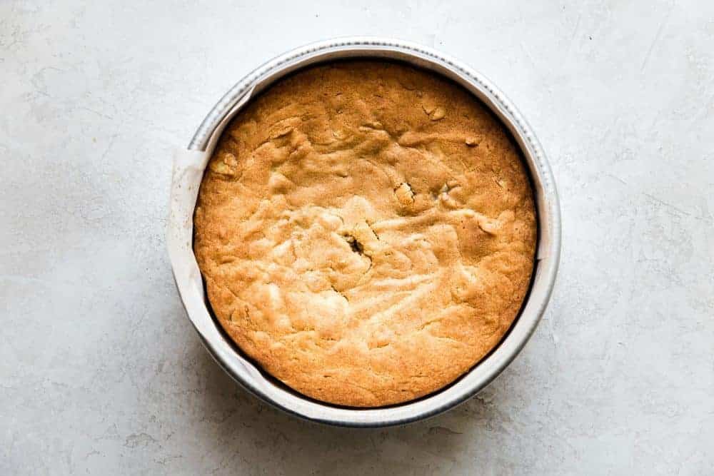 Easy Brown Butter Almond Cake is an incredibly delicious and moist cake with a brown butter icing. This is seriously one of the best cakes that I have EVER had! This is a must-make for that baking list! Brown butter almond cake fresh out of the oven before slicing.
