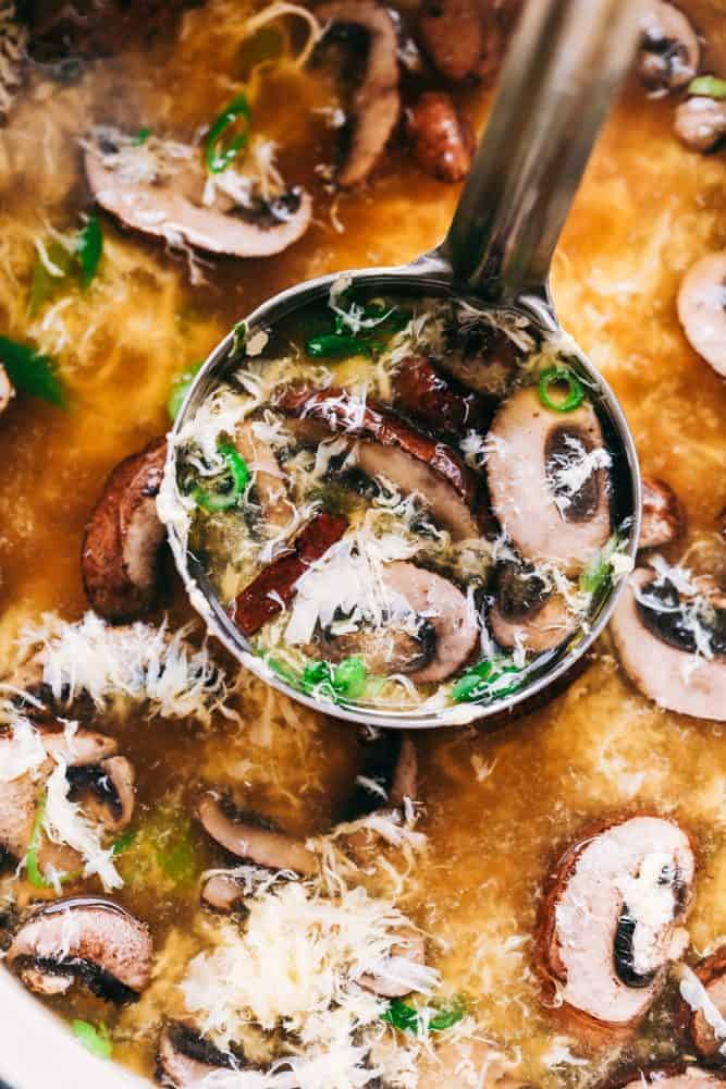 Egg Drop Soupย is a warm,ย thickened broth, with rich flavors of chicken andย beautiful eggย ribbons throughout.ย Enjoy this savory, simple to make soup recipe that comes together in just 15 minutes. Ladle scooping up some egg drop soup.