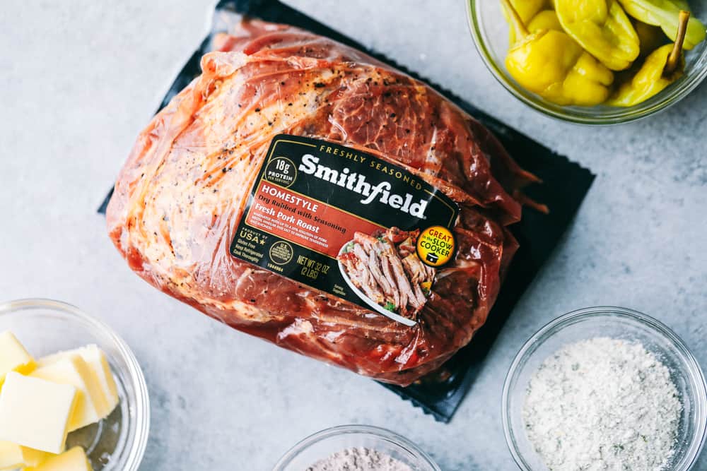 Slow Cooker Mississippi Pork Roastย is a savory, sweet and spicy pork roast that is tender to the touch and falls apart with ease. It takes minutes toย prepare and can be paired with a variety of sides. Your family will fall in love with this incredibly flavorful, melt in your mouth pork roast!ย Smithfield pork roast in wrapper.