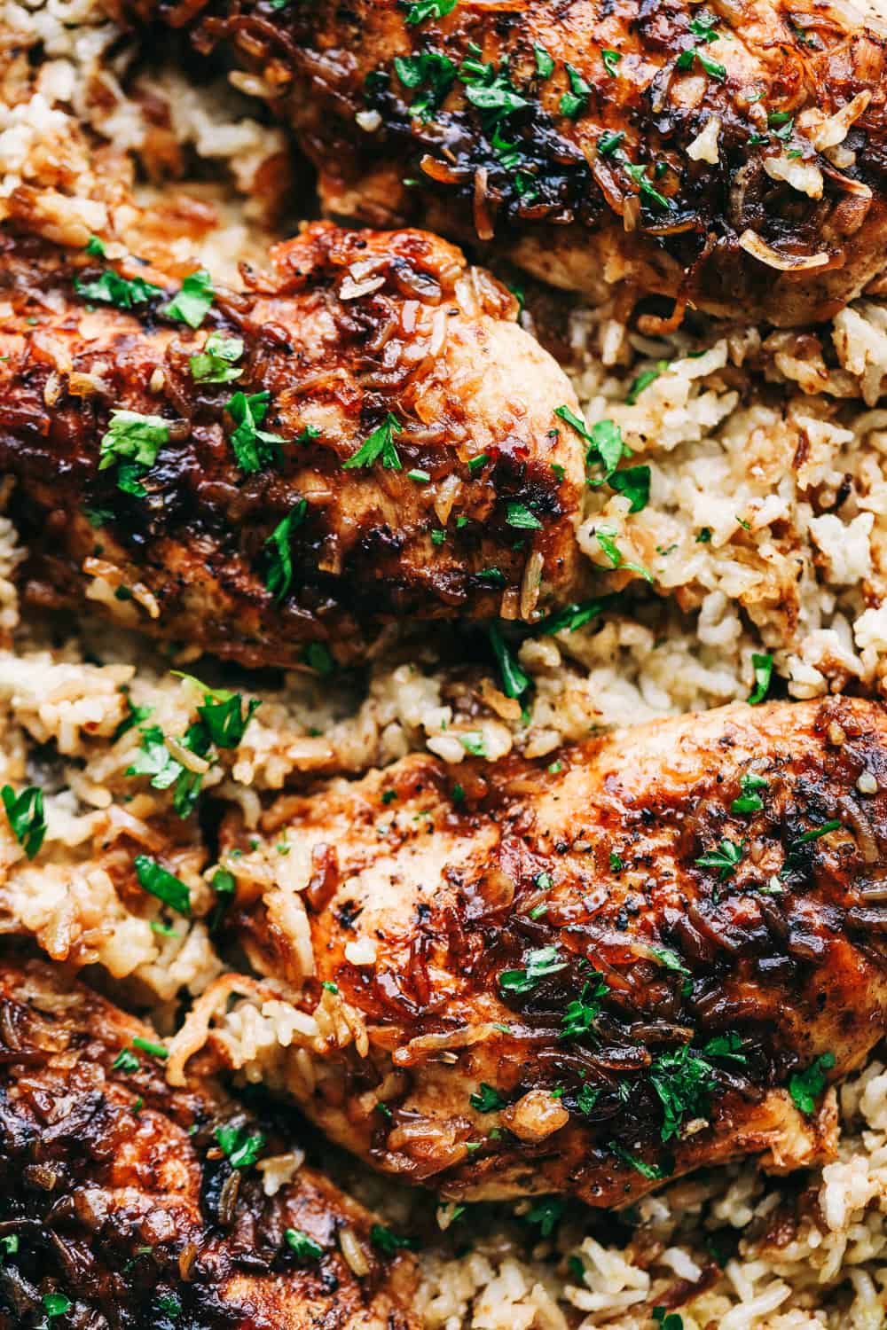 No Peek Chicken and Rice Casseroleย is full of comfort and tender, fall apart chickenย overtopping a flavorful rice thatย makes this meal a family favorite! Baking to perfection with the warm, steamย cooking the chicken and rice to perfection.ย No Peek Chicken and Rice Casseroleย up close.