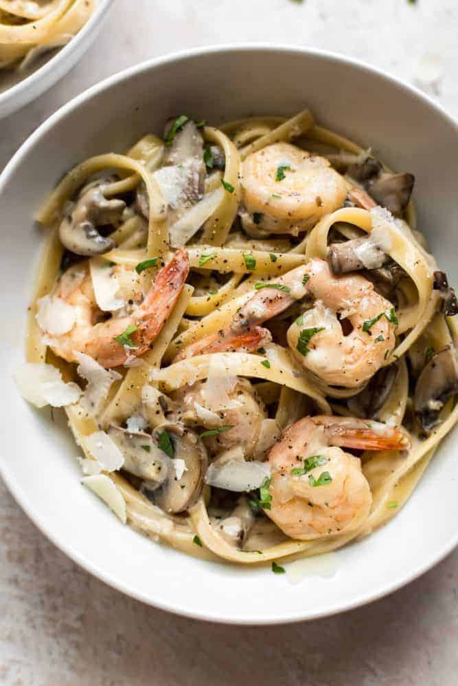 Creamy Shrimp and Mushroom Pasta. Who says weeknight dinners have to be boring? This restaurant-worthy pasta dish can be on your table in under 30 minutes, so you'll have more time to spend with your family. Creamy Shrimp and Mushroom Pasta in a white bowl.