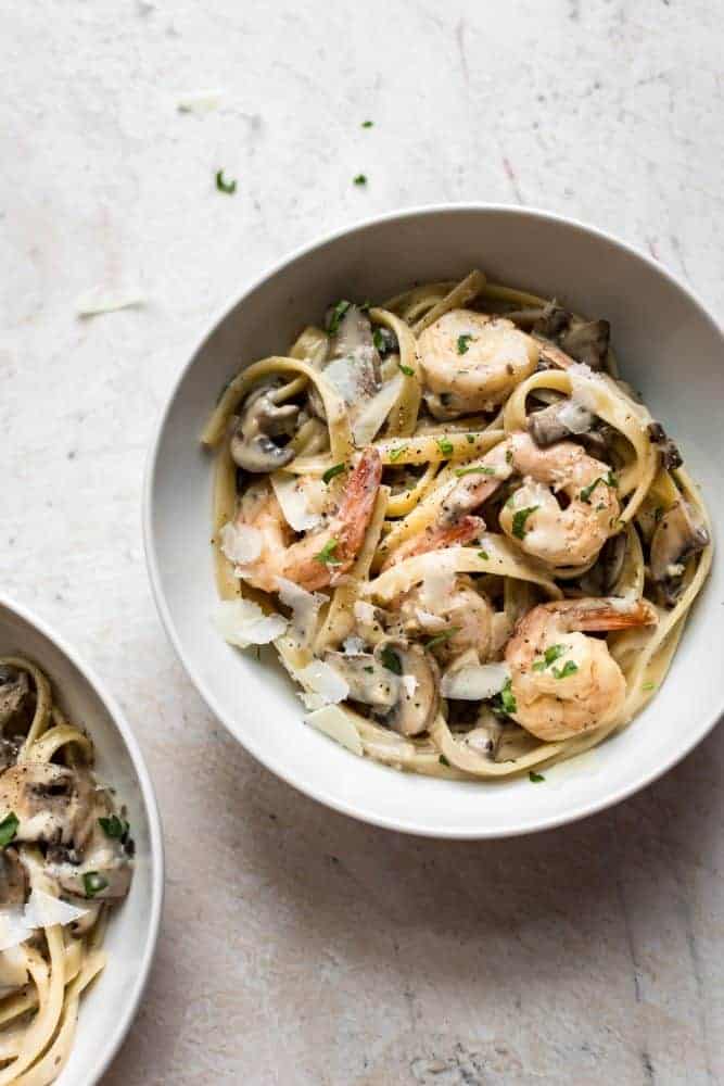 Creamy Shrimp and Mushroom Pasta. Who says weeknight dinners have to be boring? This restaurant-worthy pasta dish can be on your table in under 30 minutes, so you'll have more time to spend with your family. Creamy Shrimp and Mushroom Pasta in a white bowl.