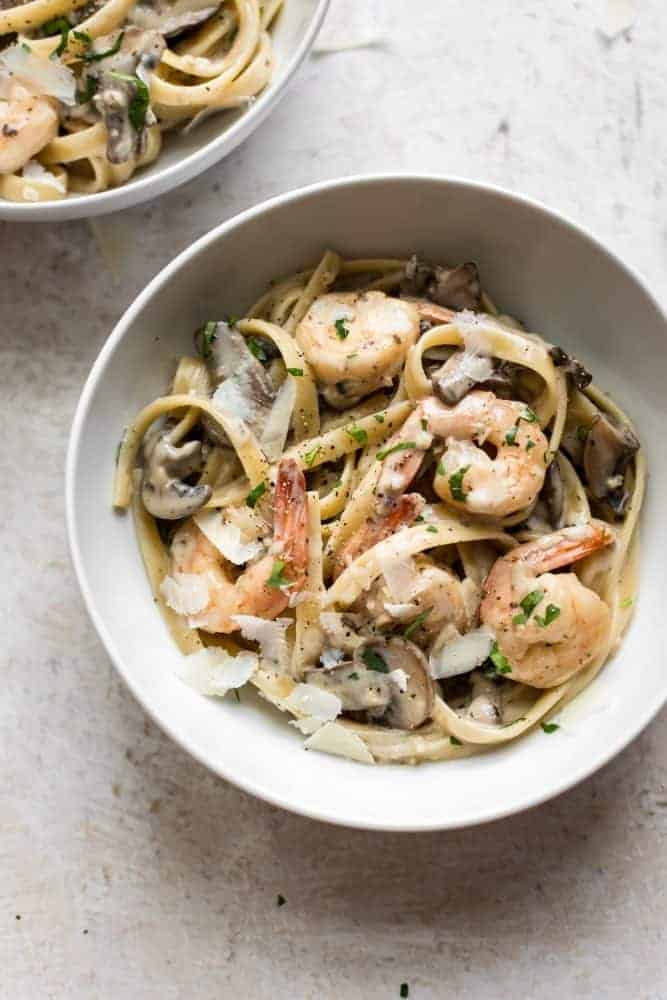 Creamy Shrimp and Mushroom Pasta. Who says weeknight dinners have to be boring? This restaurant-worthy pasta dish can be on your table in under 30 minutes, so you'll have more time to spend with your family. Creamy Shrimp and Mushroom Pasta in a white bowl.