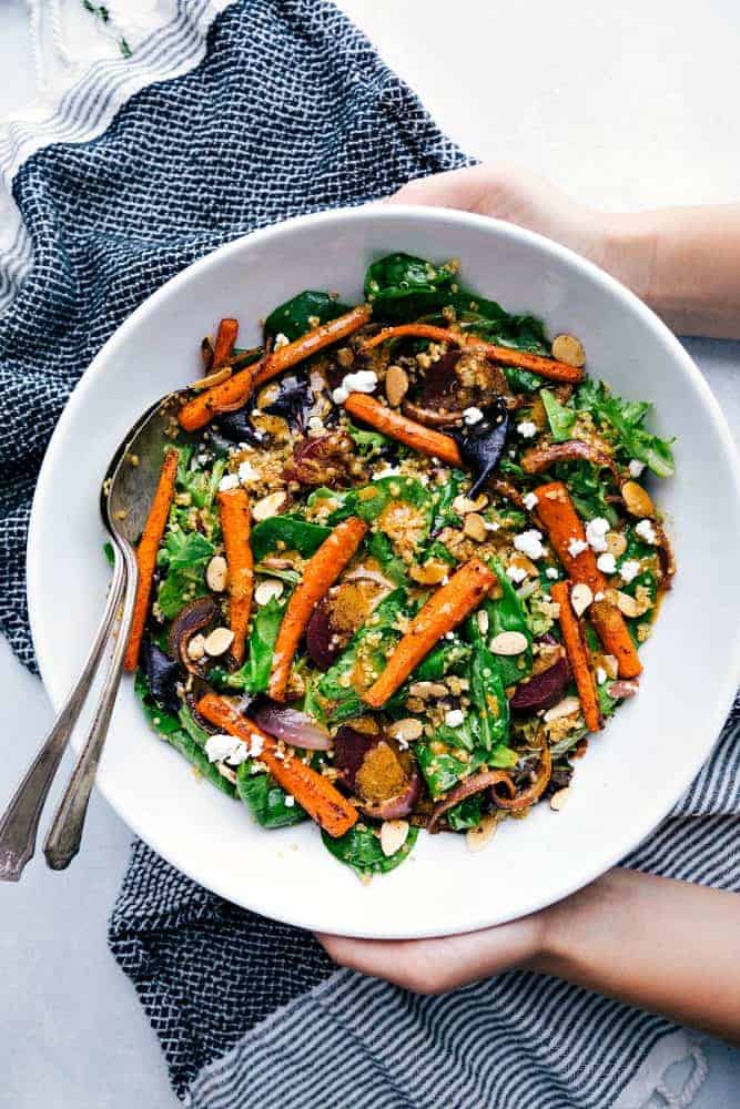 This roasted beet, quinoa, and carrot salad is packed with healthy and good-for-you ingredients! It's super flavorful and has the best lemon dressing! This roasted beet, quinoa, and carrot salad in a bowl.